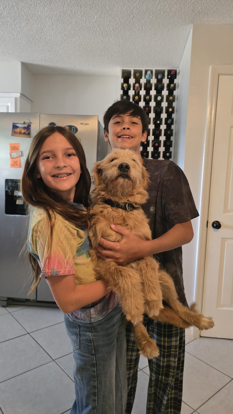 Lexi and Ryan holding Cooper